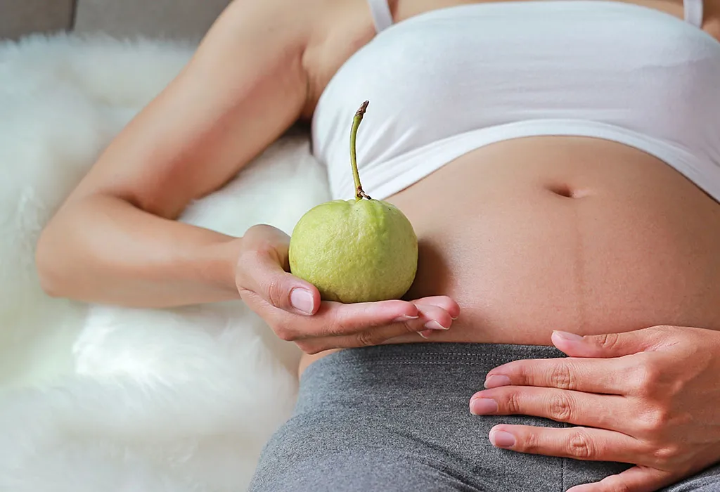 women with guava in hand
