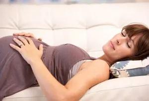 Pregnant woman sleeping on back