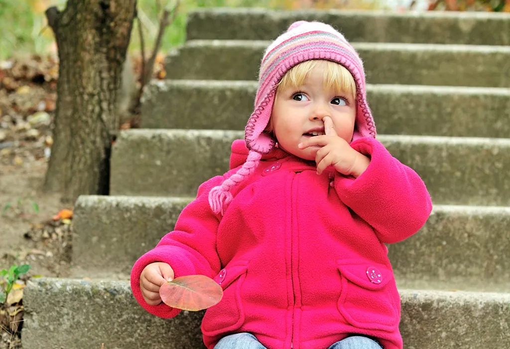 Child picking her nose
