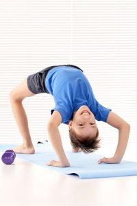 child doing bridge pose