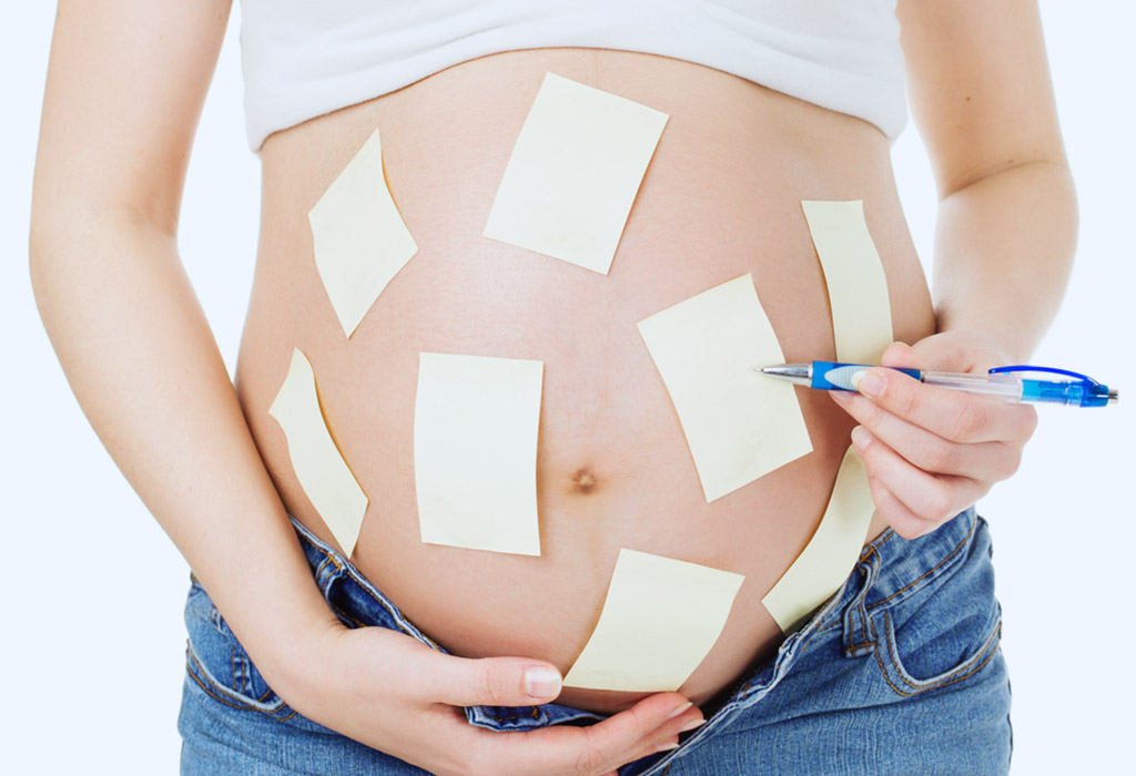 Pregnant women with stickers on belly