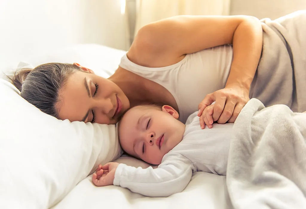 Baby sleeping with mom