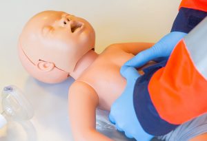 Giving chest compression to a infant