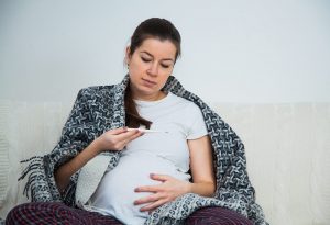 pregnant woman having high temperature after CVS test