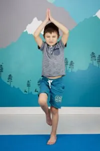child doing mountain pose