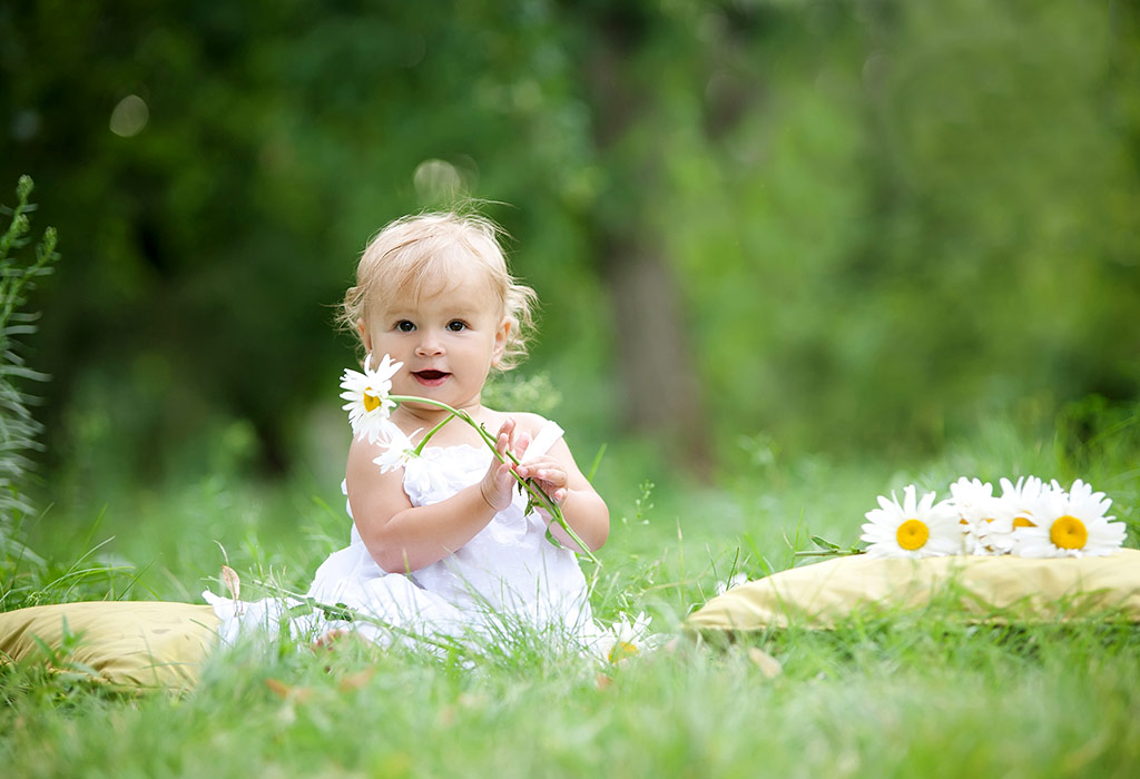 Baby exploring flowers