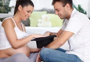 Parents-to-be discussing baby name options
