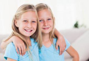 Twin girls in blue t-shirts