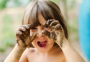 Kid with soil while playing