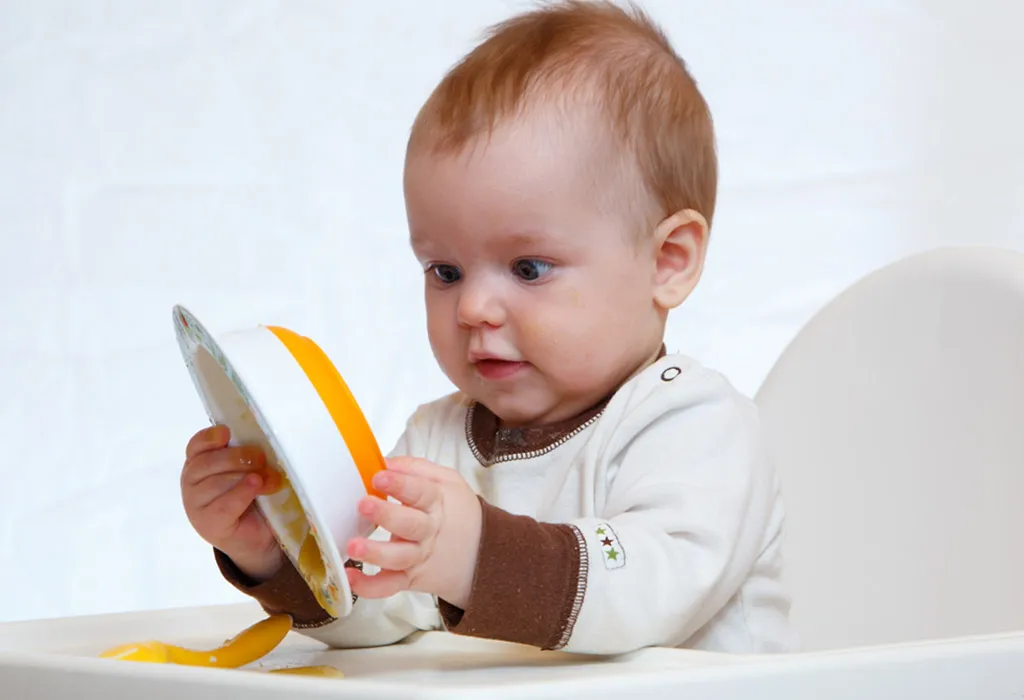 baby picking up food