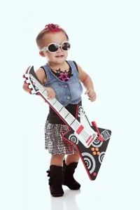 A boy dressed as a rockstar