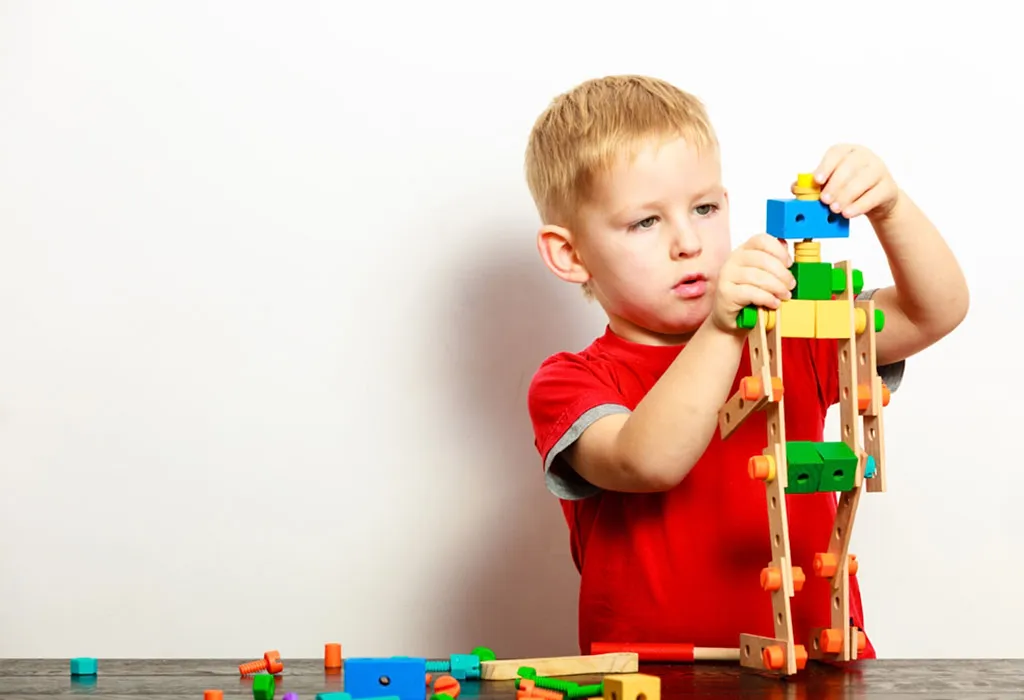 A child playing and making robot
