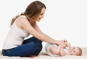Mother massaging her baby