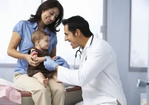 Doctor examining child