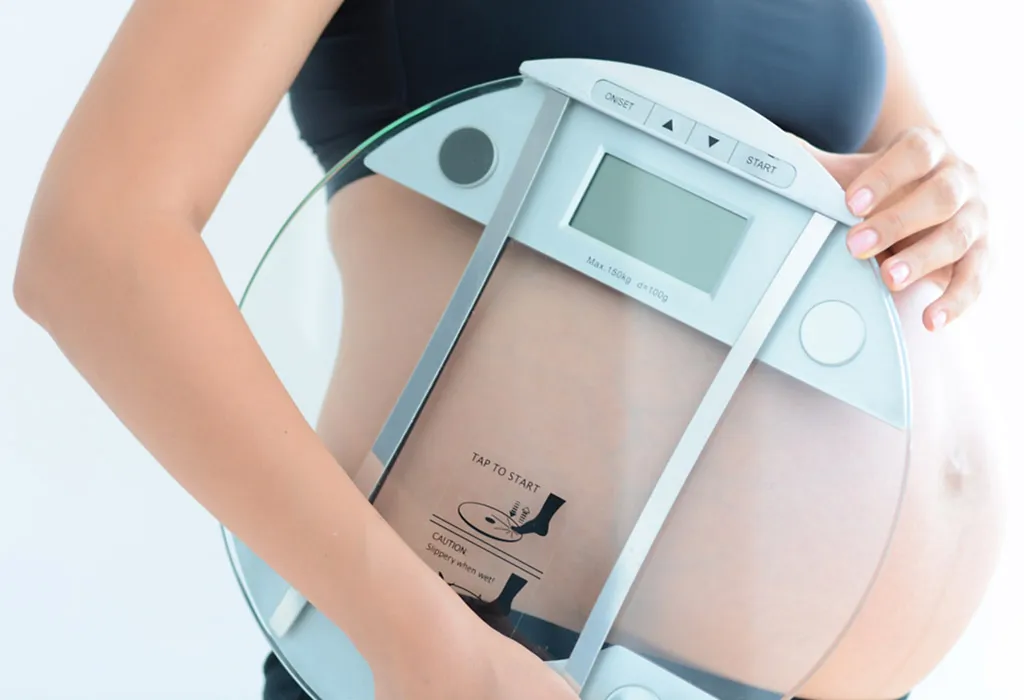 Pregnant woman monitoring weight