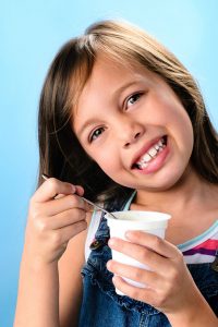 Girl eating yoghurt