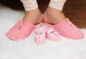 Pregnant Woman's Feet on Soft Surface