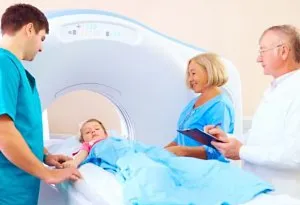 A child being taken for a scan