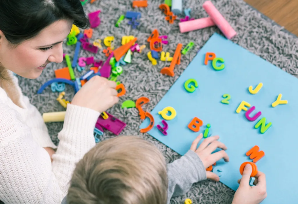 Child playing with letters
