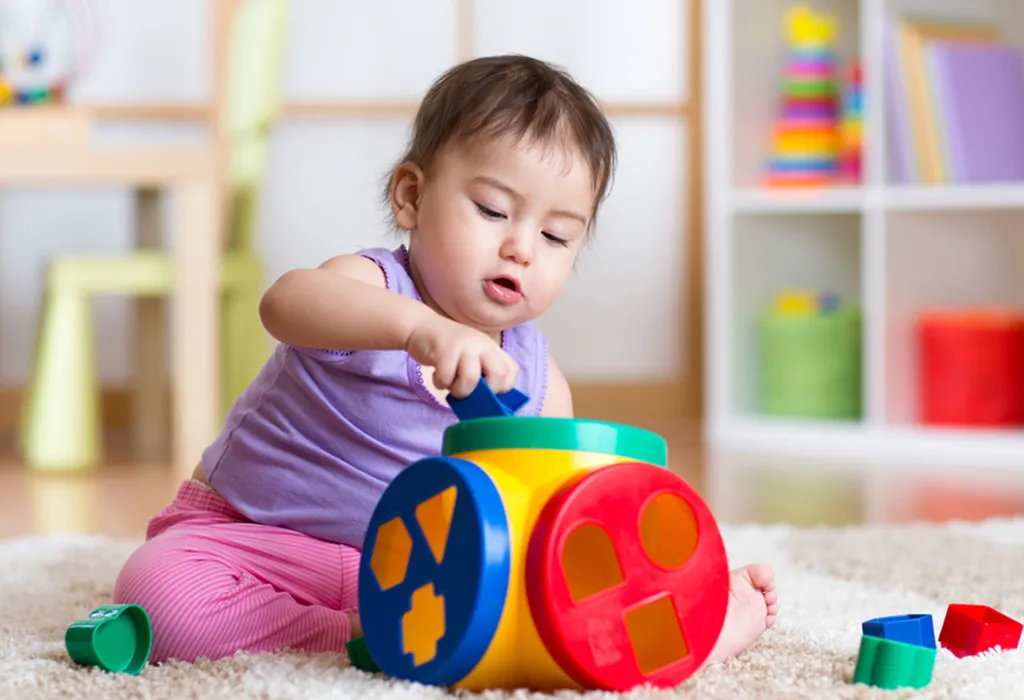 Child playing with a shapes puzzle