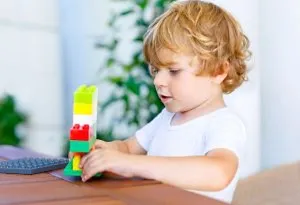 Child playing toys alone 