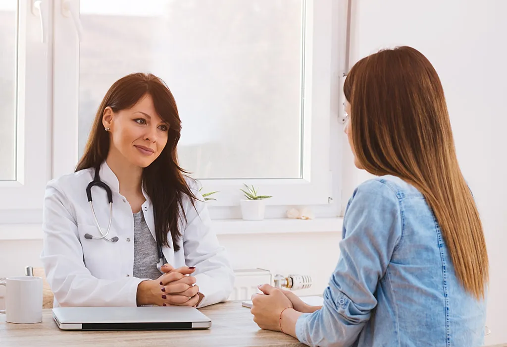 Doctor asking general queries to young Woman