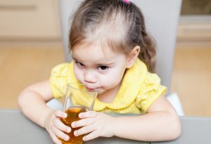 Kid drinking apple juice
