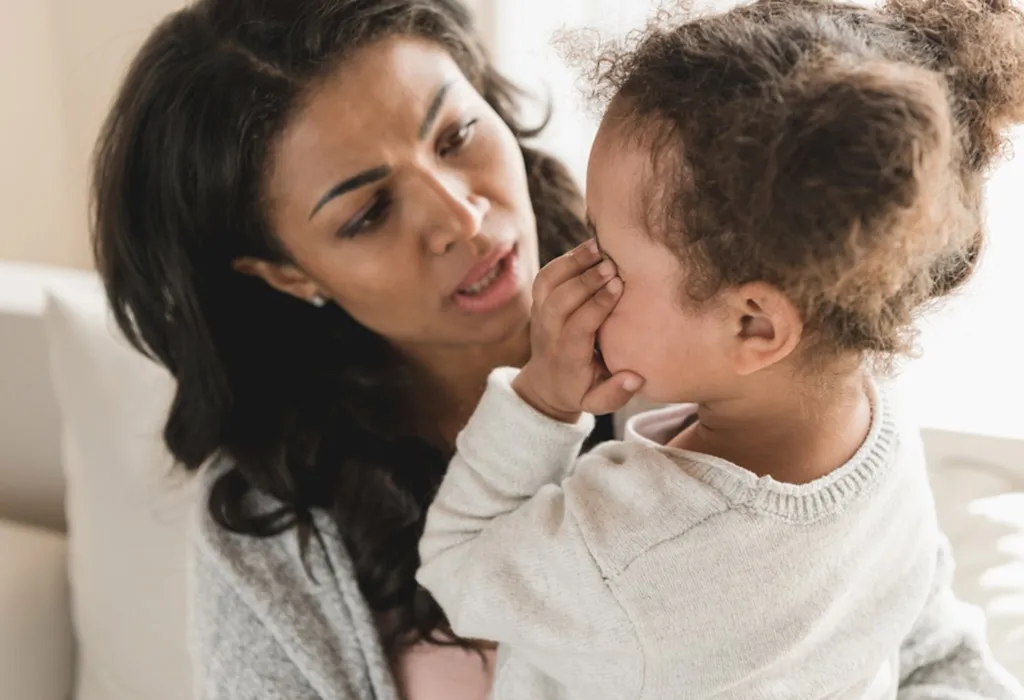 Worried mother with crying daughter