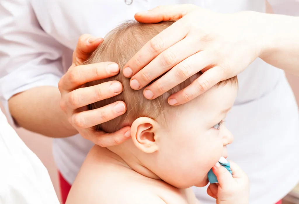 Massaging baby's  head