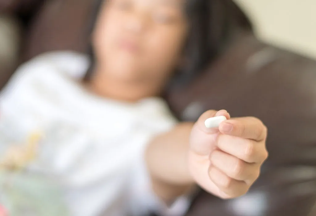 child taking aspirin