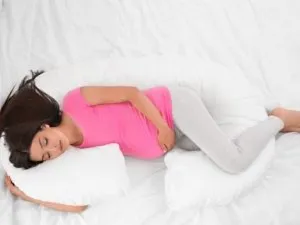 Pregnant woman sleeping on her side