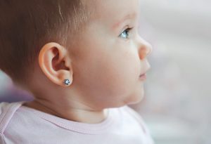 Baby with pierced ear