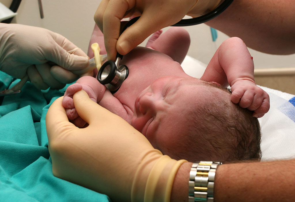Doctor checking Respiration of baby