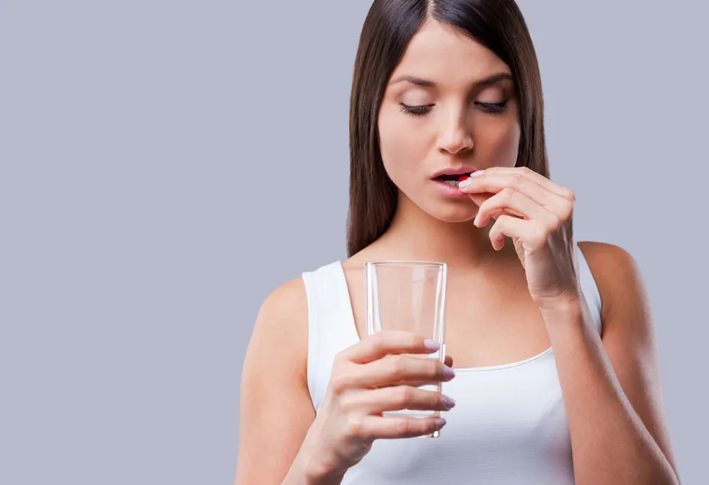 Woman taking pills