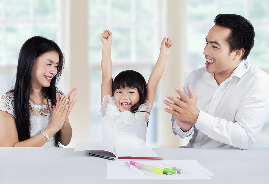 Parents clapping for child