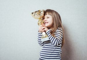 Child holding trophy
