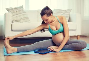 pregnant woman doing leg exercises