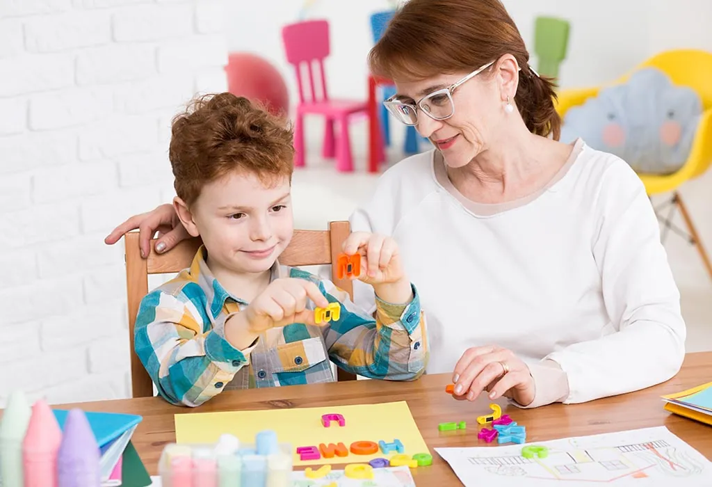 A teacher helping a child