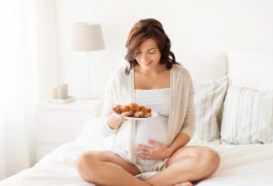 pregnant woman eating junk food