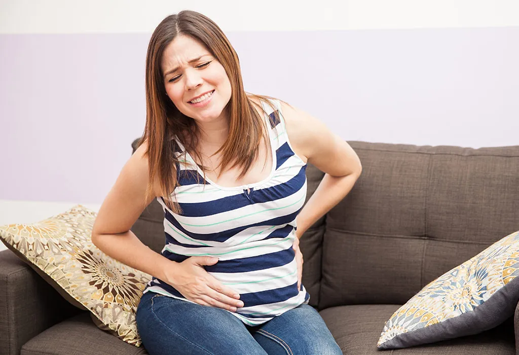A pregnant woman experiencing discomfort