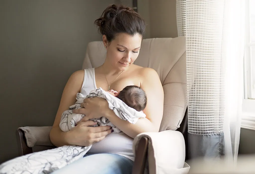 A mother breastfeeding her infant