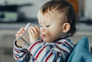 A little boy drinking water