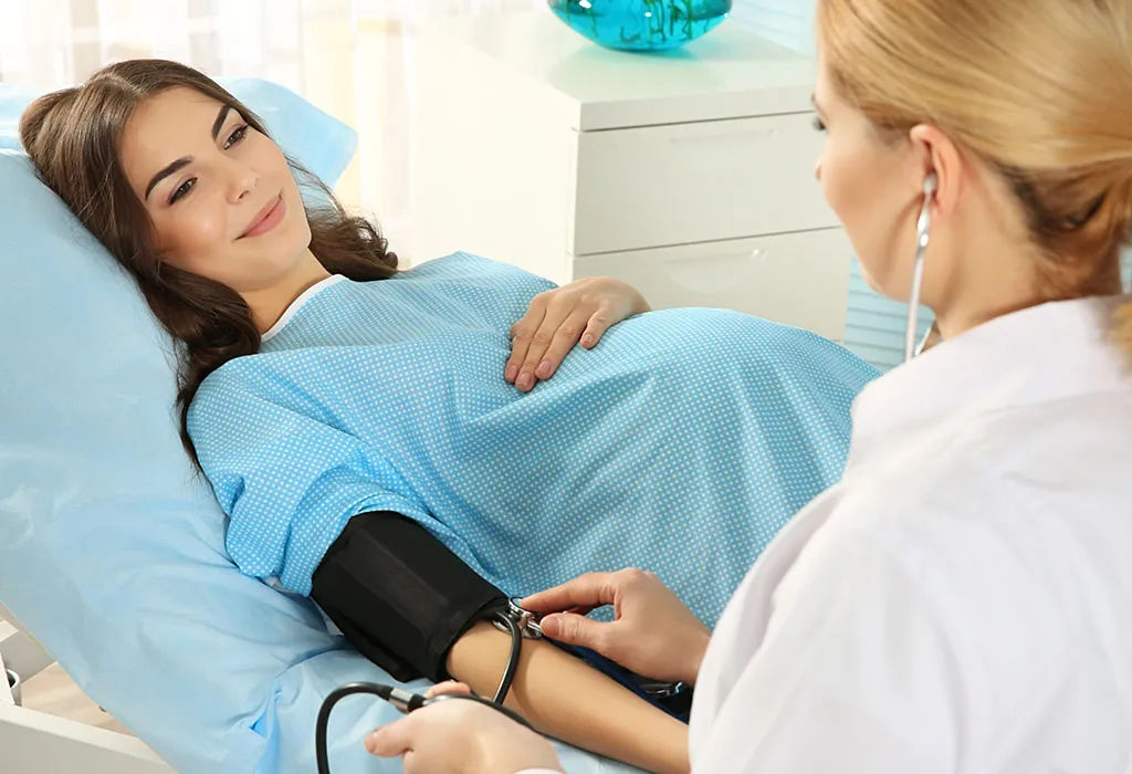 A doctor examining a pregnant woman