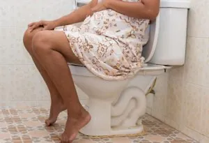 Pregnant woman on the toilet