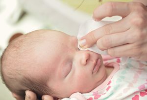 Cleaning a newborn's eye