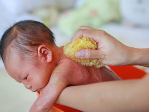 giving a newborn a sponge bath