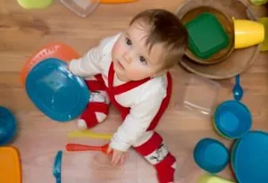 Baby playing with utensils