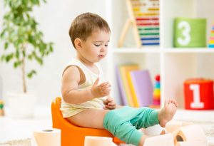 11-month-old baby sitting on potty