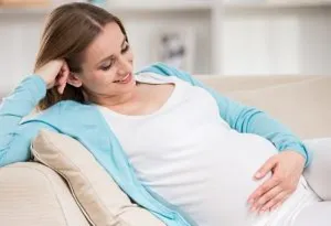 A pregnant woman admiring her belly