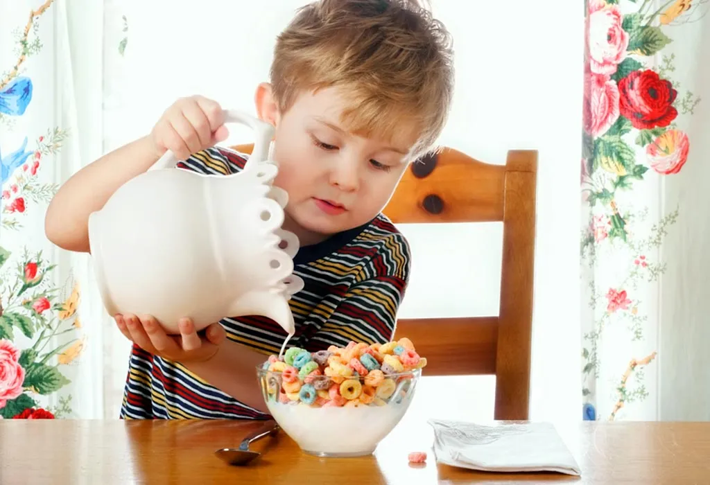 A child preparing a bowl of cereal on his own